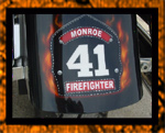 Firefighter badge with real fire